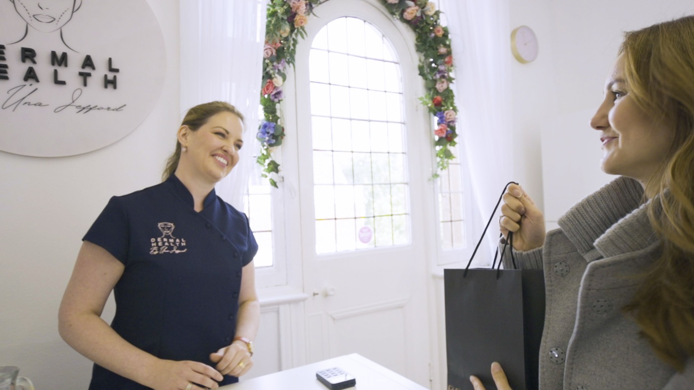 Úna Jefford welcoming a customer at the Dermal Health clinic reception
